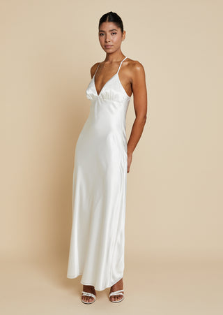 Quarter front view of bride wearing satin bias cut maxi dress