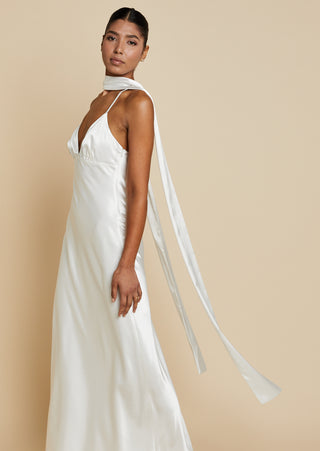 Bride wearing satin bias cut maxi dress styled with satin neck tie
