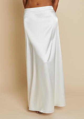 Close up front view of bride wearing white satin maxi skirt 