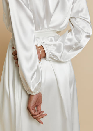 Close up back view of bride wearing satin bridal maxi length robe