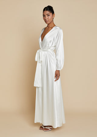 Quarter front view of bride wearing satin bridal maxi length robe