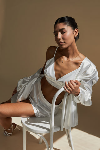Bride wearing satin robe top with satin mini shorts