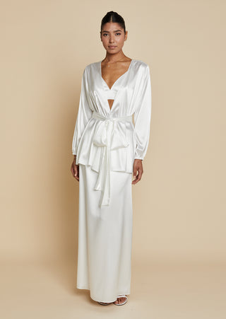 Front view of bride wearing satin robe top with satin maxi skirt