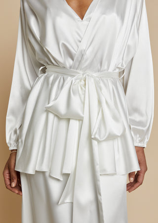 Close up of bride wearing satin robe top with satin maxi skirt