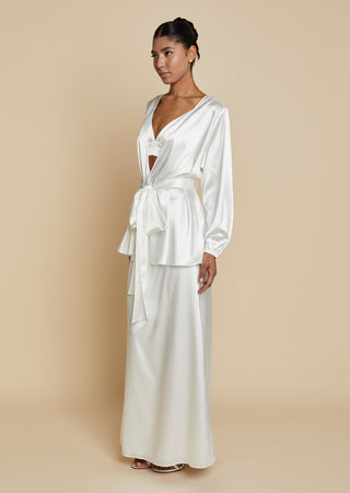Quarter front view of bride wearing satin robe top with satin maxi skirt